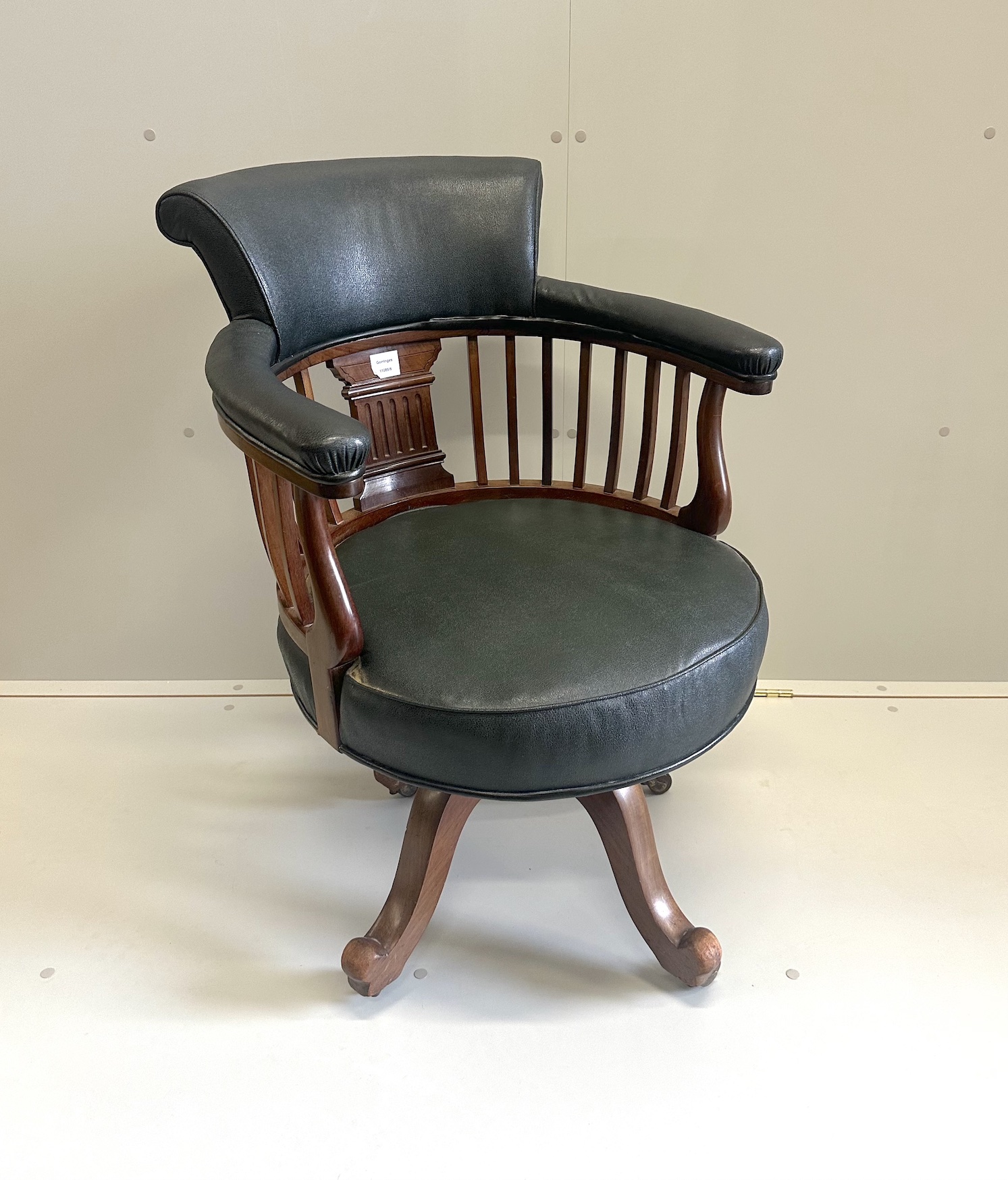 A late Victorian walnut swivel desk chair, width 60cm, depth 55cm, height 87cm